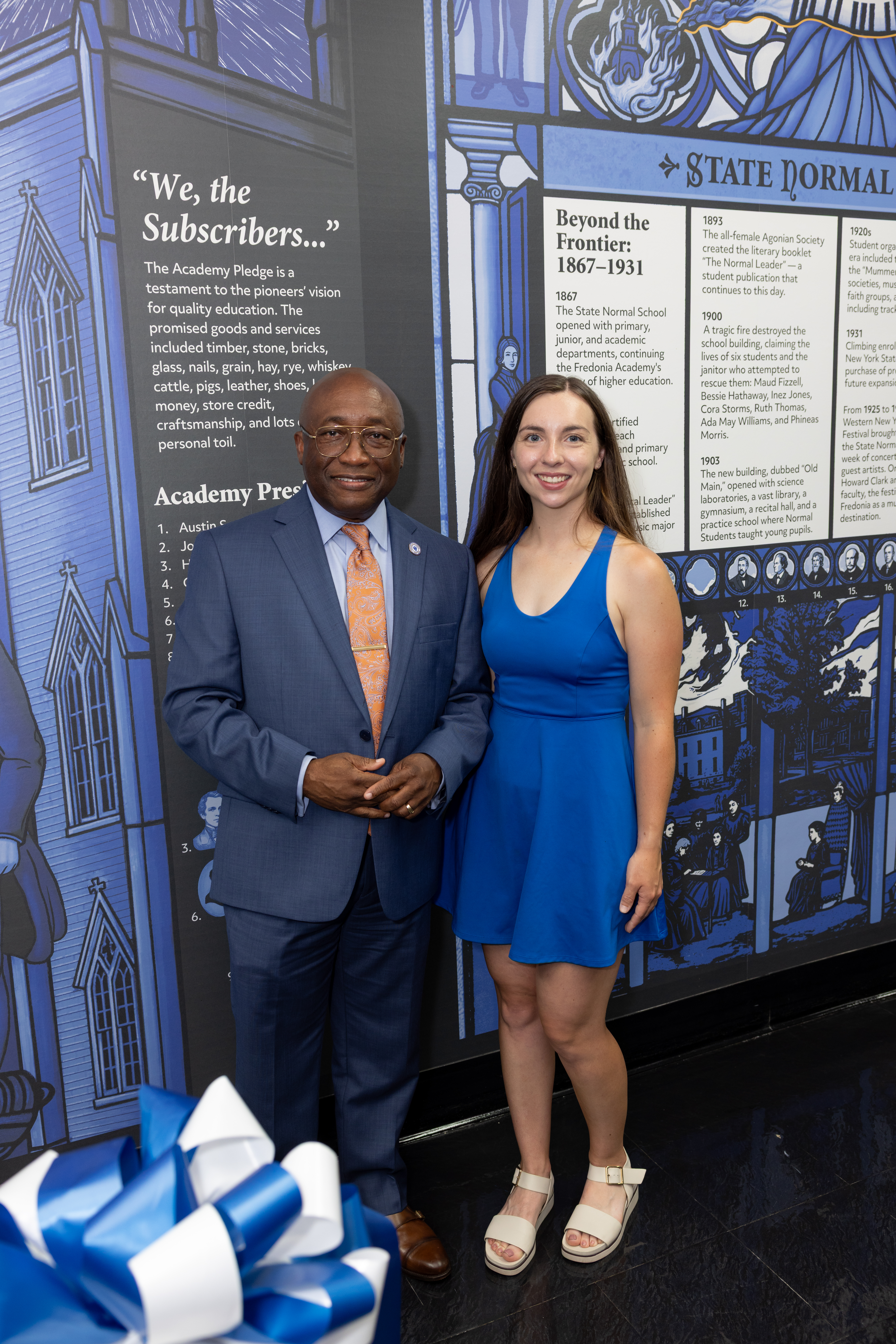 Muralist Erin Ruffino and President Kolison