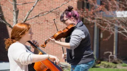 students playing music outside of Mason Hall