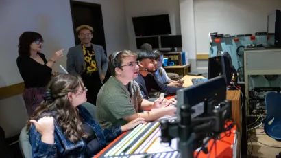 students in a television control room produce a TV program