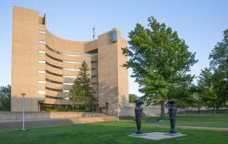 Maytum Hall seen in the late afternoon as the shadow of Mason Hall begins to cover it's facade. 