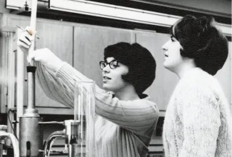 two women working in a lab in the 1960s